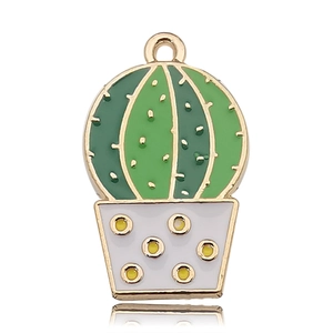 Close-up of a cute cactus charm with green enamel and a golden finish for DIY jewelry