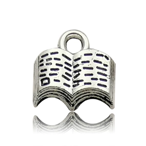 Macro view of an open book alloy pendant charm in antique silver for DIY jewelry