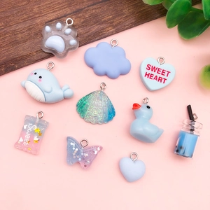 Blue pastel resin charms set with cute dolphin, duck, and candy shapes for DIY jewelry