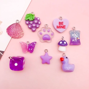 Detailed set of ten purple and pink resin pendants including heart and cat paw shapes