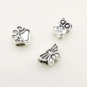 DIY silver snake bone bracelet charms set featuring antique owl, paw print, and butterfly