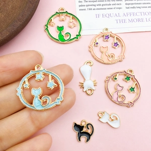 Detailed view of handmade colorful enamel cat charms for DIY necklaces and keychains