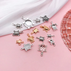 Set of 15 antique silver and gold sea turtle charms for DIY jewelry making and crafts