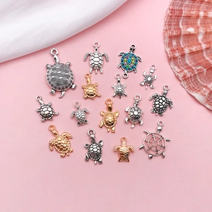 Assorted turtle jewelry charms in gold and silver finishes for DIY jewelry making