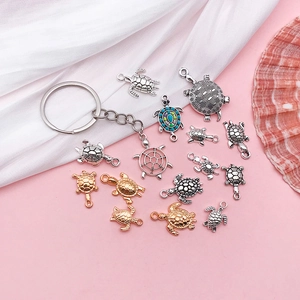 Detailed set of assorted turtle pendants in antique silver and gold for DIY jewelry