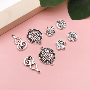 Vintage silver dragon and Fu character charms set for punk style jewelry and accessories