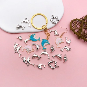 Handmade dolphin charm pendants in blue and pink enamel for DIY jewelry making