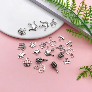 Detailed view of antique silver crown pendants for DIY jewelry with Princess engraving