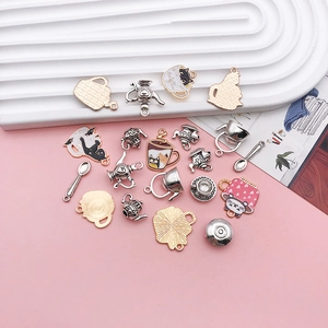 Detailed macro view of assorted cute teacup cat alloy charms for DIY jewelry making