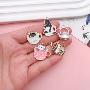 Close-up of five cute enamel alloy cat cafe charms with a teapot for DIY jewelry making