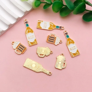 Detailed view of creative acrylic beer bottle and mug charms for DIY earrings and jewelry