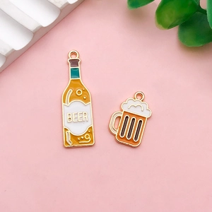 Close-up of creative acrylic beer bottle and mug charms for DIY earrings