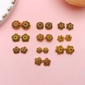 Détail de calottes de perles fleurs creuses en or antique pour bijoux vintage DIY