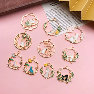 Set of 10 gold alloy cat pendants with colorful enamel flowers for DIY jewelry making