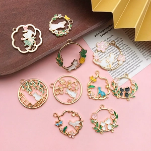Detailed set of cat and flower enamel pendants in gold finish for DIY jewelry