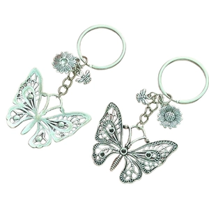 Minimalist silver butterfly keychain set with green sunflower and bee charms