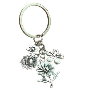 Vintage silver flower keychain set featuring sunflower and daisy charms in antique finish