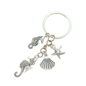 Sea life keychain with silver starfish, seahorse, and shell charms for bag decoration
