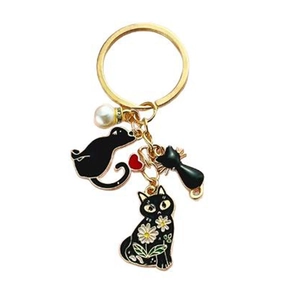 Porte-clés chat noir mignon avec marguerite, perle d'imitation et charme cœur