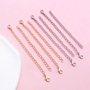 Detail of 10cm-13cm extender chains with lobster clasps in gold, rose gold, and silver