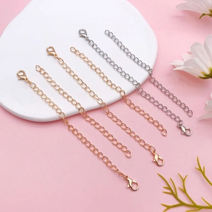 Detail of lobster clasp extender chains in gold and silver finishes for DIY jewelry