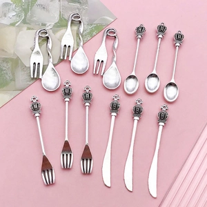 Miniature silver alloy cutlery pendants featuring crown handles with spoon fork and knife