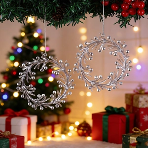Set of clear acrylic Christmas wreath pendants with silver strings on festive pine branches