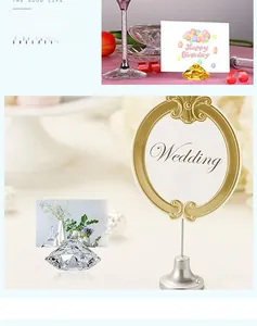 Macro shot of multifaceted crystal card holders in yellow and clear with gold supports