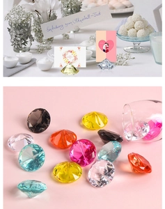 Diamond-cut crystal card holder shown in various colors for wedding table settings