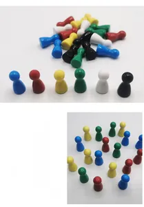 Macro shot of colorful plastic game pieces in red yellow blue green white and black colors