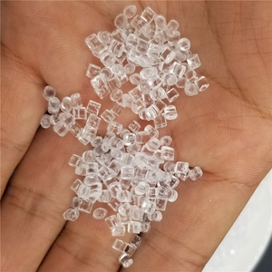 Close-up of high-transparency cylindrical acrylic rice beads held in hand for DIY crafts