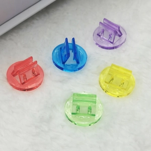Macro view of transparent acrylic game card holders in five colors for board game setup
