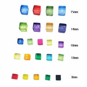 Detailed view of colorful resin cubes in 8mm to 15mm sizes for board game pieces