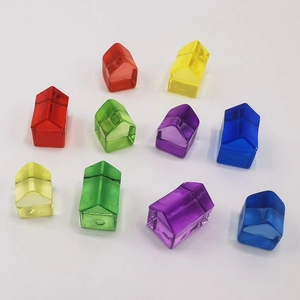 Close-up of colorful translucent resin house game pieces for board games and DIY crafts