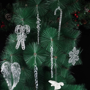 Detailed view of clear acrylic Christmas ornaments including icicles and snowflakes