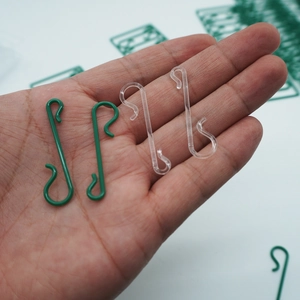 S-shaped plastic Christmas ornament hooks in green and transparent for holiday decor
