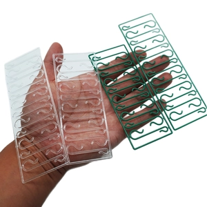 Green and transparent plastic S-hooks for Christmas tree ornaments and decorations