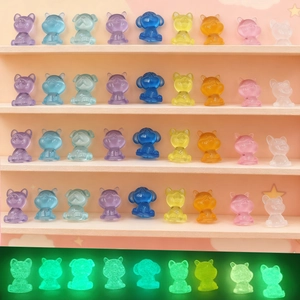 Glow in the dark miniature resin puppies in various translucent colors for car dashboard