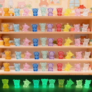 Detailed view of colorful luminous resin bears arranged on a tiered wooden display shelf
