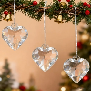 Faceted heart crystal ornaments with silver strings for festive holiday decorations