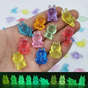Luminous resin mini bunnies in various colors showing glow-in-the-dark effect for DIY crafts