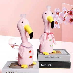 Detailed view of pink plush flamingos with pearl necklace and checkered bow ties