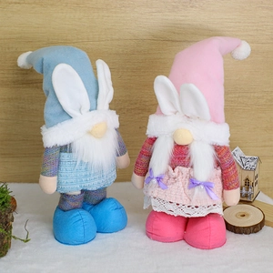 Detail of blue and pink Easter gnomes with rabbit ears and soft plush texture