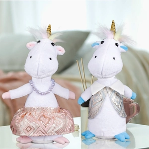 Close-up of plush unicorn couple set wearing pearl necklace and decorative outfits