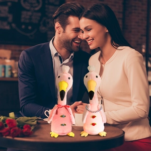 Detail view of pink flamingo plush toys with LED lights for Valentine's romantic gift