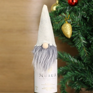 Detail of white felt hat and grey faux fur beard on Christmas gnome wine bottle cover