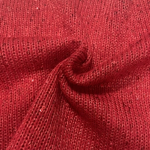 Vintage red chunky knit fabric with shiny sequins and festive metallic jacquard texture