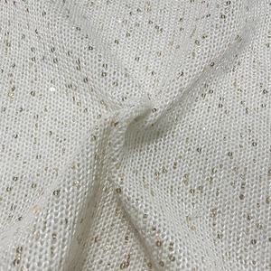 White knit fabric with gold sequins featuring delicate hollow weaving and soft texture
