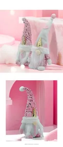 Pink and white gnome plush with sequins and golden unicorn horns for holiday decor