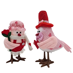 Detail view of handmade fabric Valentine birds with rose and heart holiday ornaments